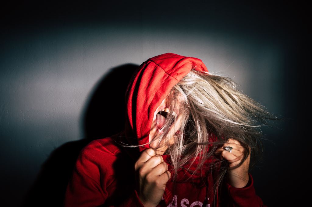 A woman screaming in a red hood sweater
Photo by
Jan Kopřiva on Unsplash
on
Unsplash