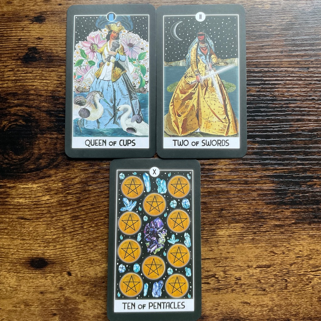 Queen of Cups, Two of Swords and Ten of Pentacles from the Intuitive Night Goddess Tarot