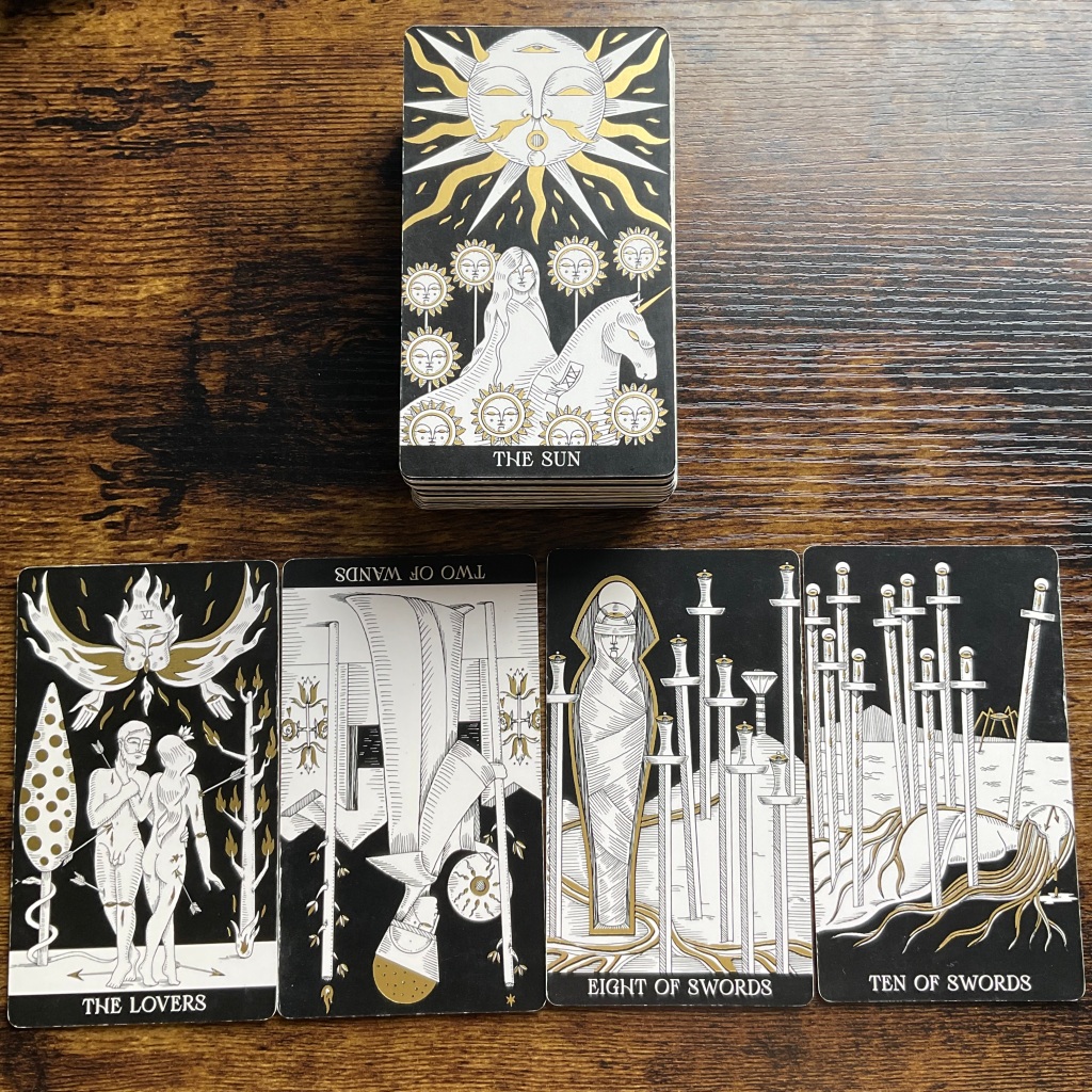 The Sun, The Lovers, Two of Wands in reverse, Eight of Swords, and Ten of Swords from the Symbolic Soul Tarot