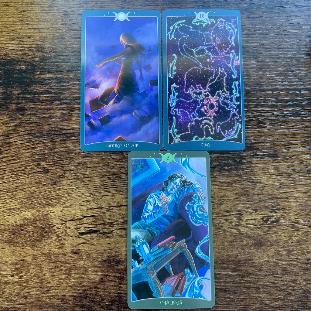 Mother of Air, Ten of Fire, and Five of Chalices from the Book of Shadows Tarot